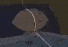 a cartoon character with a surprised look on his face is laying in bed