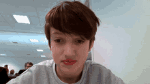 a woman with red lipstick on her lips and a white shirt
