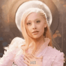 a woman in a pink dress and white hat is holding her hands on her chest .