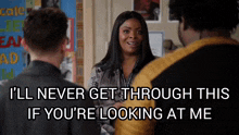 a woman is talking to two men and says " i 'll never get through this if you 're looking at me