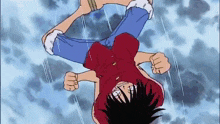 monkey d luffy is doing a handstand in the air .
