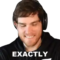 a man wearing headphones and a black shirt with the word exactly written on it