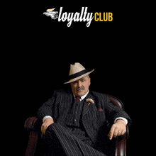 a man in a suit sits in a chair with the words show your loyalty join da family