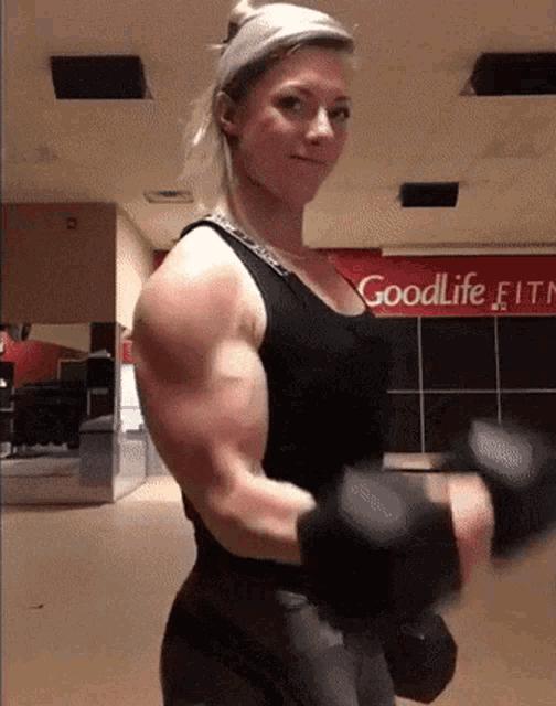 female bodybuilder flexing biceps - Playground