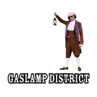 a man in a gaslamp district costume with a lantern in his hand