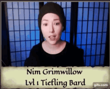 a woman in a black hat with the name nim grimwillow on it