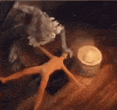 a painting of a woman being attacked by a monster with a bowl of food in the background