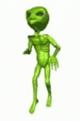 a green alien is standing and talking on a cell phone .