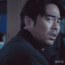 a close up of a man 's face with the word netflix on the bottom