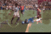 a soccer game is being played in front of a banner that says " the global "