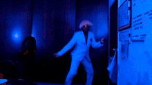a blurry picture of a person dancing in front of a white board that says ' i 'm sorry ' on it