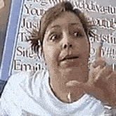 a woman is making a funny face in front of a sign that says `` you just trust me '' .