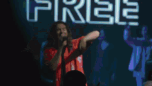 a man playing drums in front of a banner that says endless