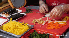 a red apron that says made in animatica on it