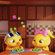 two cartoon chickens are sitting at a table eating a salad
