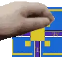 a hand is reaching out towards a blue building