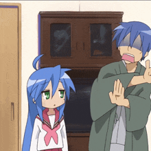a man and a girl are standing next to each other and the girl has blue hair and green eyes