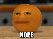 an orange with a face on it and the word nope under it