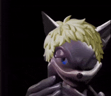 a close up of a cartoon character 's face with a yellow hair .