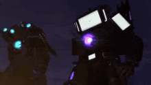 a group of robots are standing next to each other in the dark .