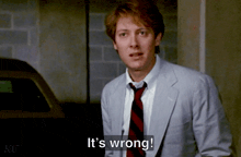 a man in a suit and tie is saying " it 's wrong "