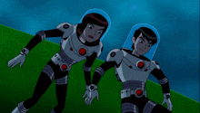 a boy and a girl are standing next to each other wearing space suits