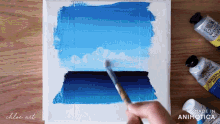 a person is painting with a brush and a bottle of newton 's galeria acrylic paint