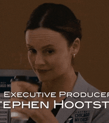 a woman drinking from a cup with executive producer stephen hootst written on the bottom