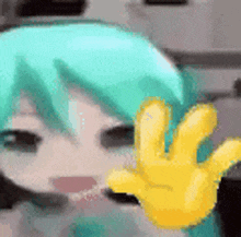 a close up of a person 's face with a yellow hand in front of it .