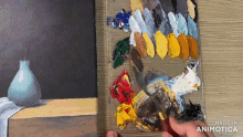 a person is painting a picture with the words made in animatica on the bottom right