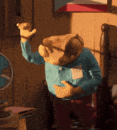 a stuffed animal with a frog head is standing in a room