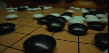 a board game with black and white stones on a table