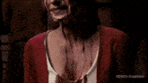 a woman with blood coming out of her mouth and chest