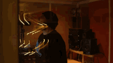 a man wearing a black shirt that says ' nirvana ' on it is standing in front of a microphone