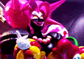 a giant pink balloon with a smiley face on it is surrounded by other balloons