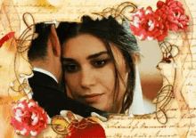 a picture of a man and woman in a frame with flowers