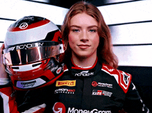 a woman holding a red and white helmet with the word academy on it