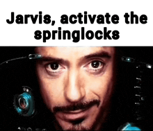 a close up of a man 's face with the words jarvis activate the springlocks above it