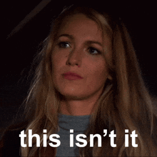 a woman 's face is shown with the words this isn 't it below her