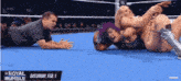 two women are wrestling in a wrestling ring and the date is february 1