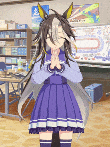 a girl in a purple dress is standing in front of a white board with chinese characters on it