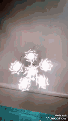 a video showing a snowflake is made with the videoshow app