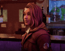 a woman in a red jacket with a patch on her chest that says ' a '