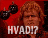 a man with red hair is making a funny face with the words hvad written on the bottom