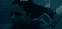 a person is swimming in the water with their arm outstretched