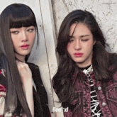 two girls are standing next to each other and one of them is wearing a purple jacket that says bea xl