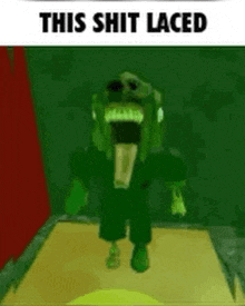 a green monster is standing in a dark room with a tongue sticking out .