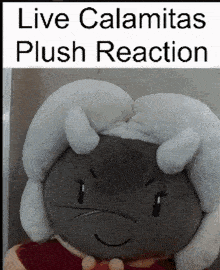 a stuffed animal with the words live calamitas plush reaction written above it