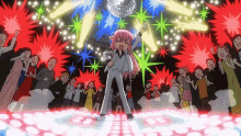 a girl with pink hair is dancing in front of a disco ball in a crowd of people
