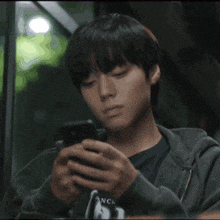 a person is typing on a cell phone with a message that says bitch lmao at this shit
